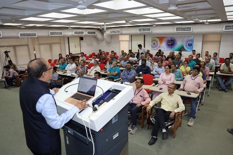 Dr. K.R. Suresh Nair speaking to scientists in a lecture hall at the Institute for Plasma Research, Ahmedabad